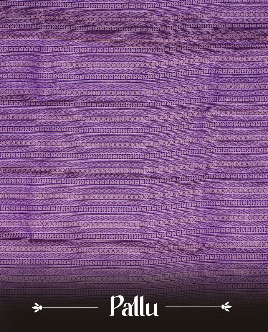 Indigo colour soft silk saree featuring rose Gold zari motifs on body, complemented by self colour with traditional border, paired with matching blouse piece.