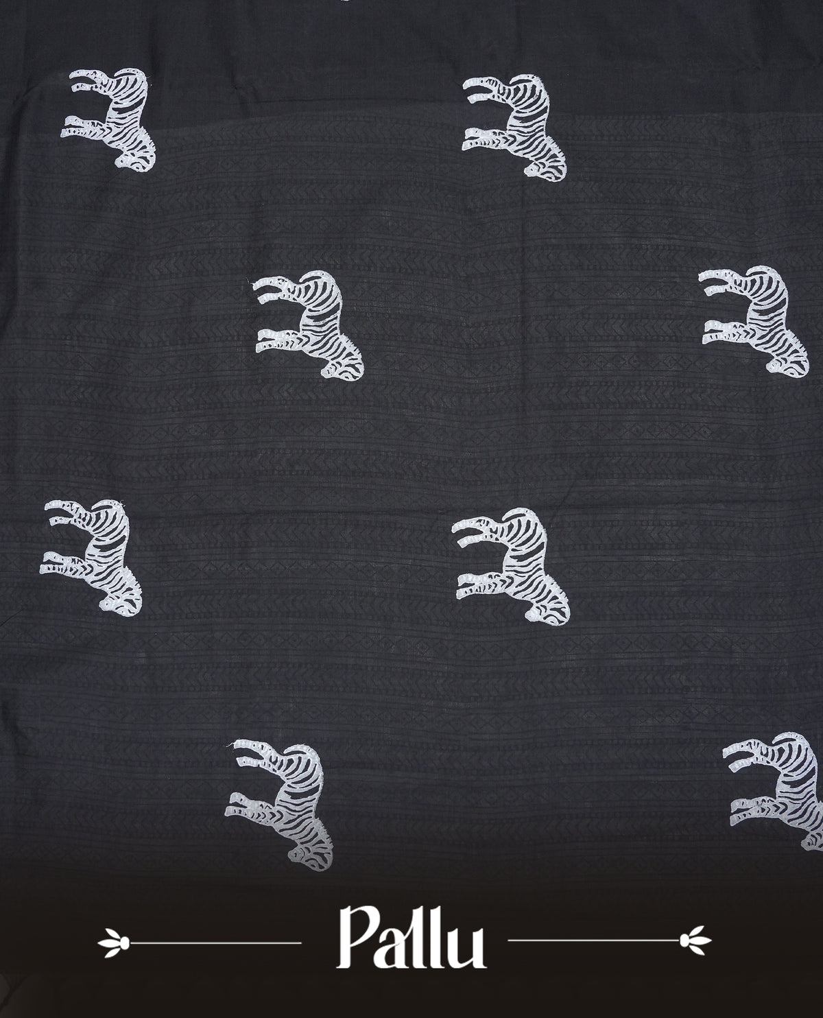 Black colour Polycotton Saree adorned with animal prints across the body and pallu, creating a graceful and minimalist look. Finished with a subtle black border and paired with a matching printed blouse piece,