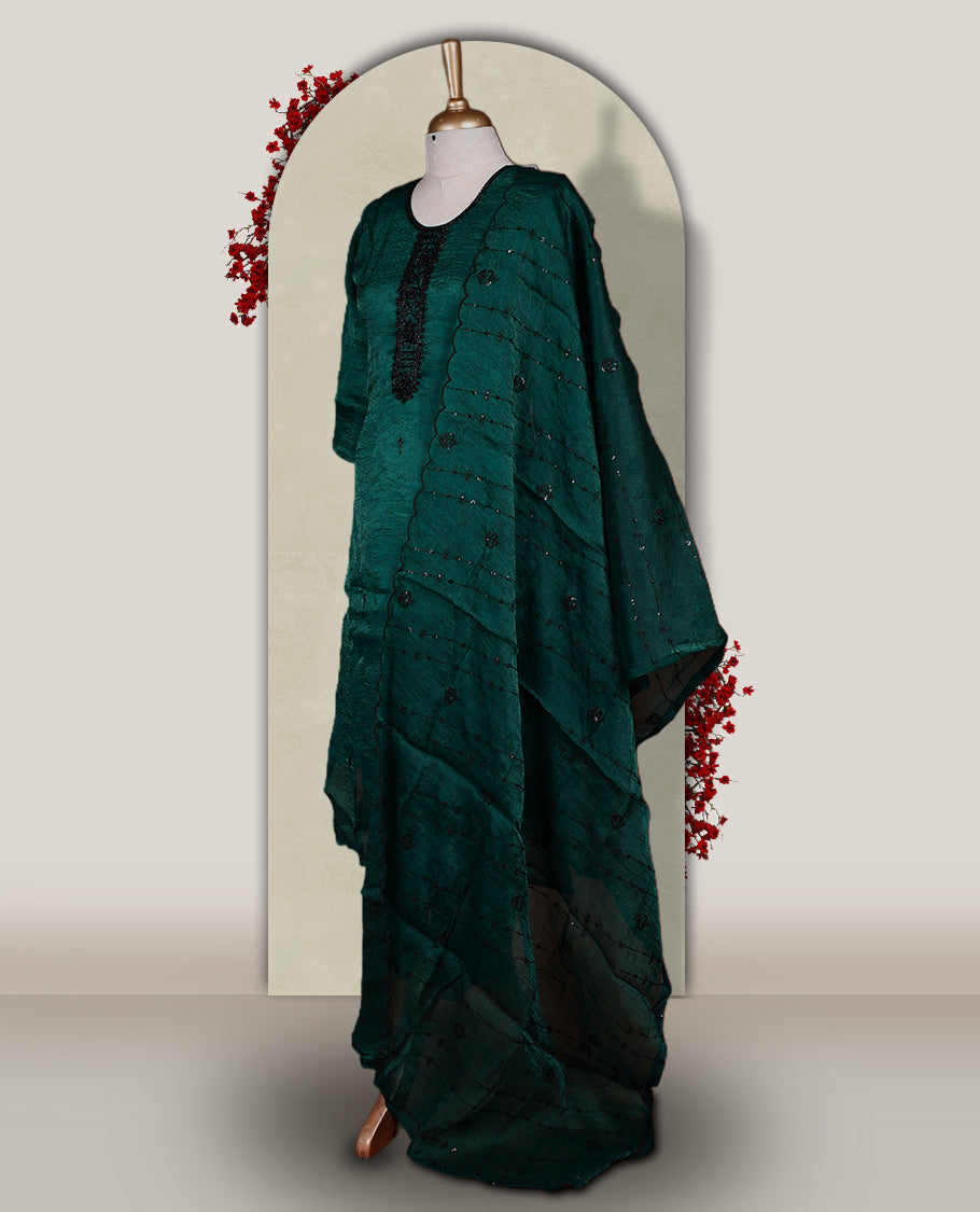 Green colour churidar set adorned with intricate black cut bead work on the neckline, paired with a matching bottom & The set comes with a lightweight embroidered dupatta, adding elegance and charm to your ethnic look.