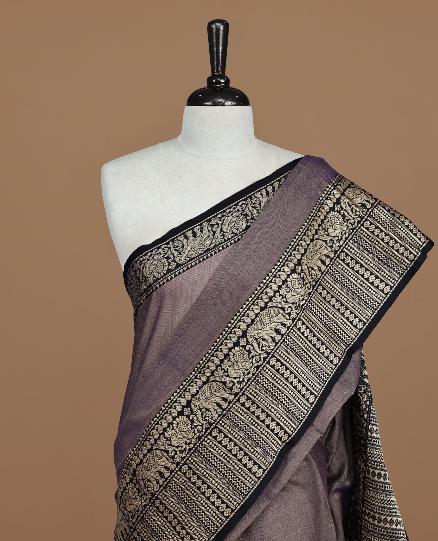 Greyish Lavender colour Narayanapett cotton saree Featuring Elegant plain Body, complemented by Contrast Black colour with cream zari border, paired with matching blouse piece.