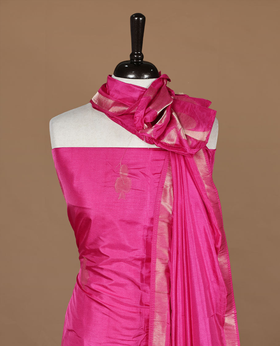 Pink colour churidar material featuring gold zari card pattern on body, border, paired with matching bottom and dupatta.