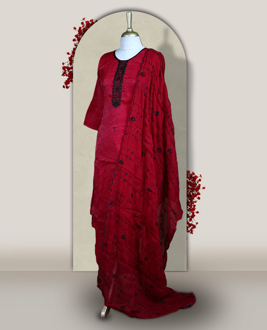 Maroon churidar set adorned with intricate black cut bead work on the neckline, paired with a matching bottom & The set comes with a lightweight embroidered dupatta, adding elegance and charm to your ethnic look.