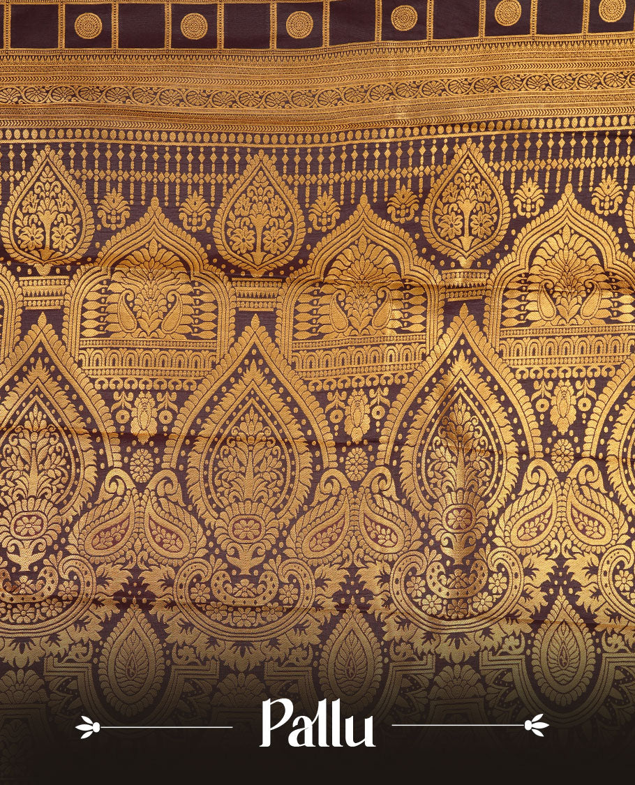 Chocolate colour soft silk saree featuring Gold zari check & motifs on body, complemented by self colour with traditional border, paired with matching blouse piece.