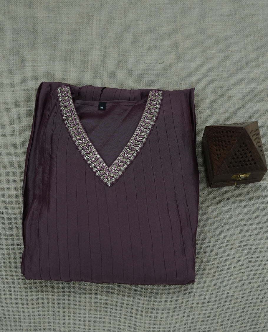 mauve colour salwar suit featuring intricate silver thread embroidery around the neckline. A graceful choice for celebrations and special occasions.