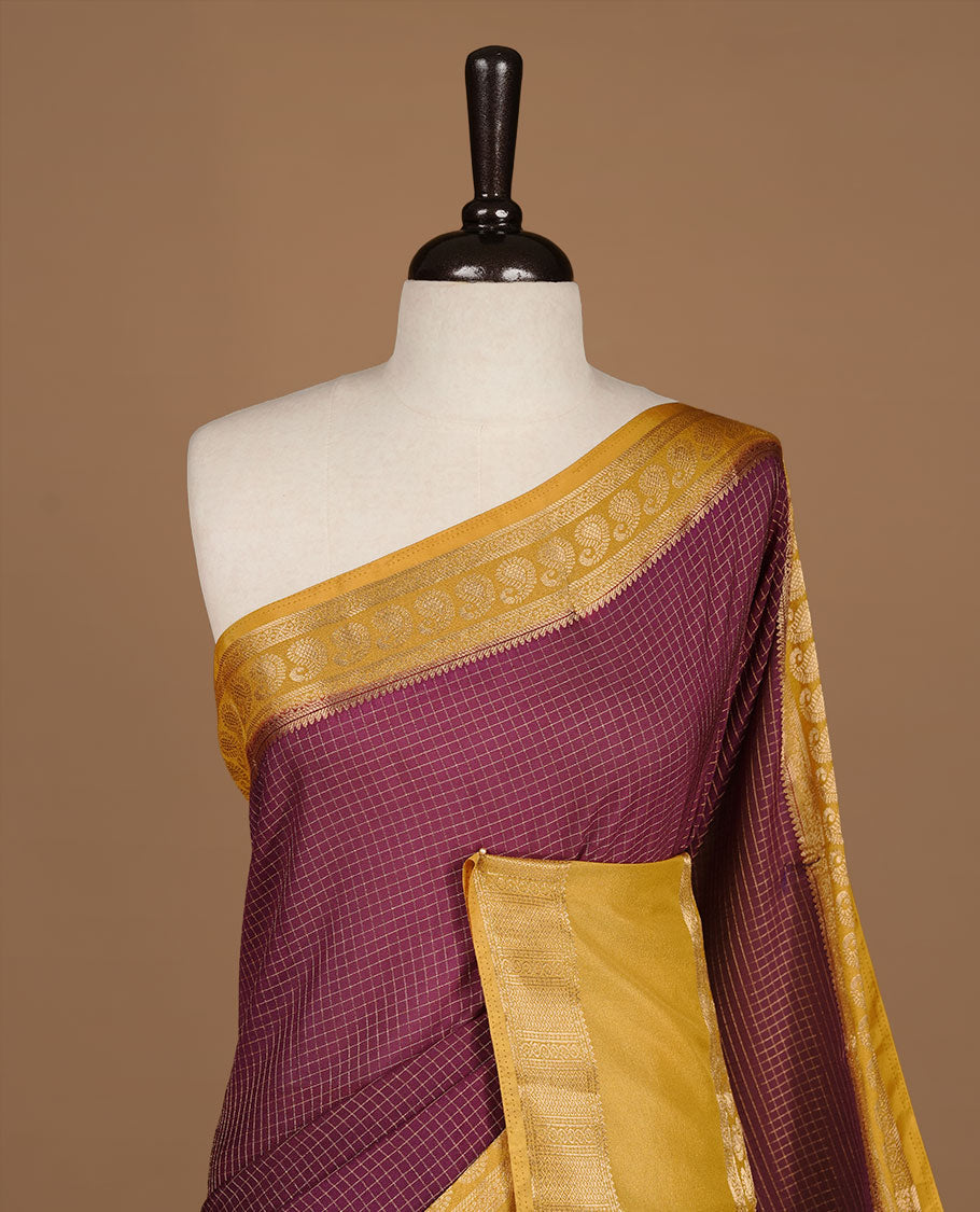 Maroon colour semi georgette saree featuring gold zari check pattern on body, complemented by contrast olive colour with zari border, paired with matching blouse piece.