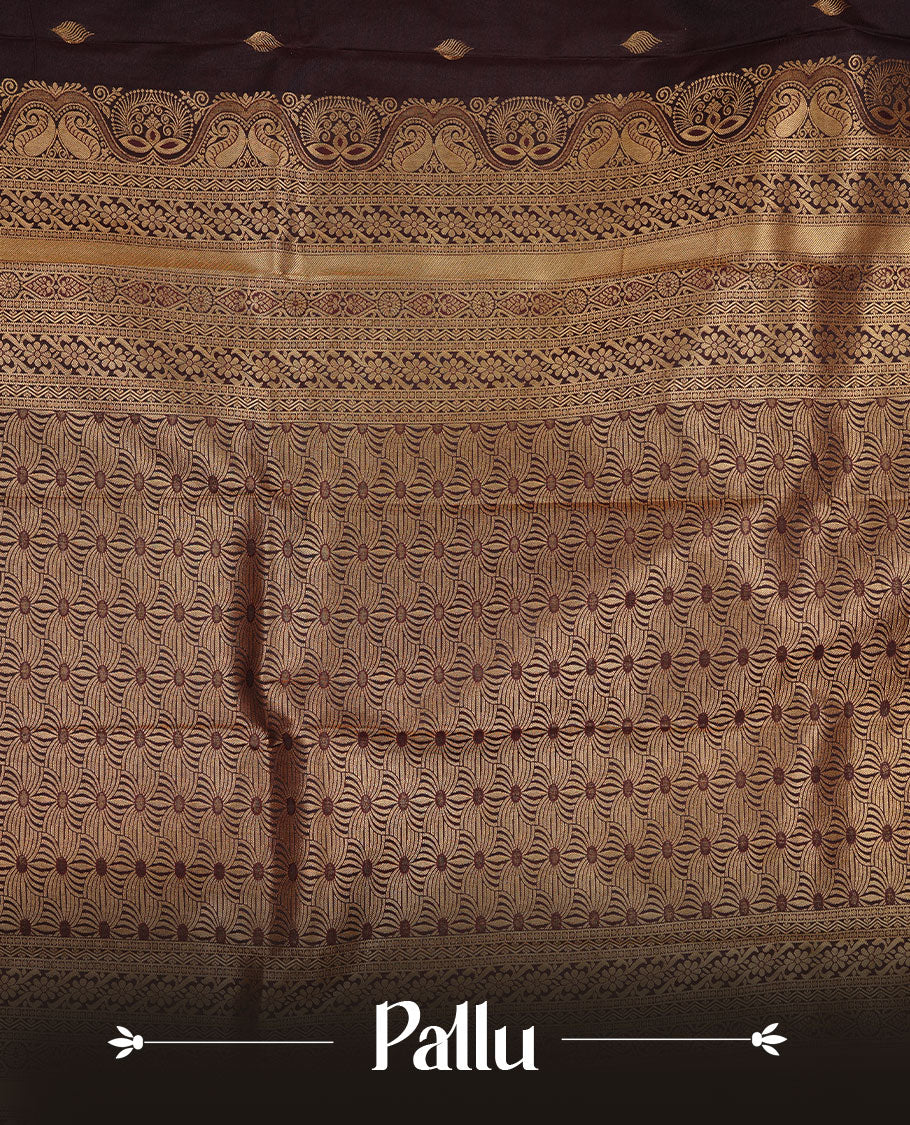 Chocolate colour soft silk saree featuring Gold zari motifs on body, complemented by self colour with traditional border, paired with matching blouse piece.