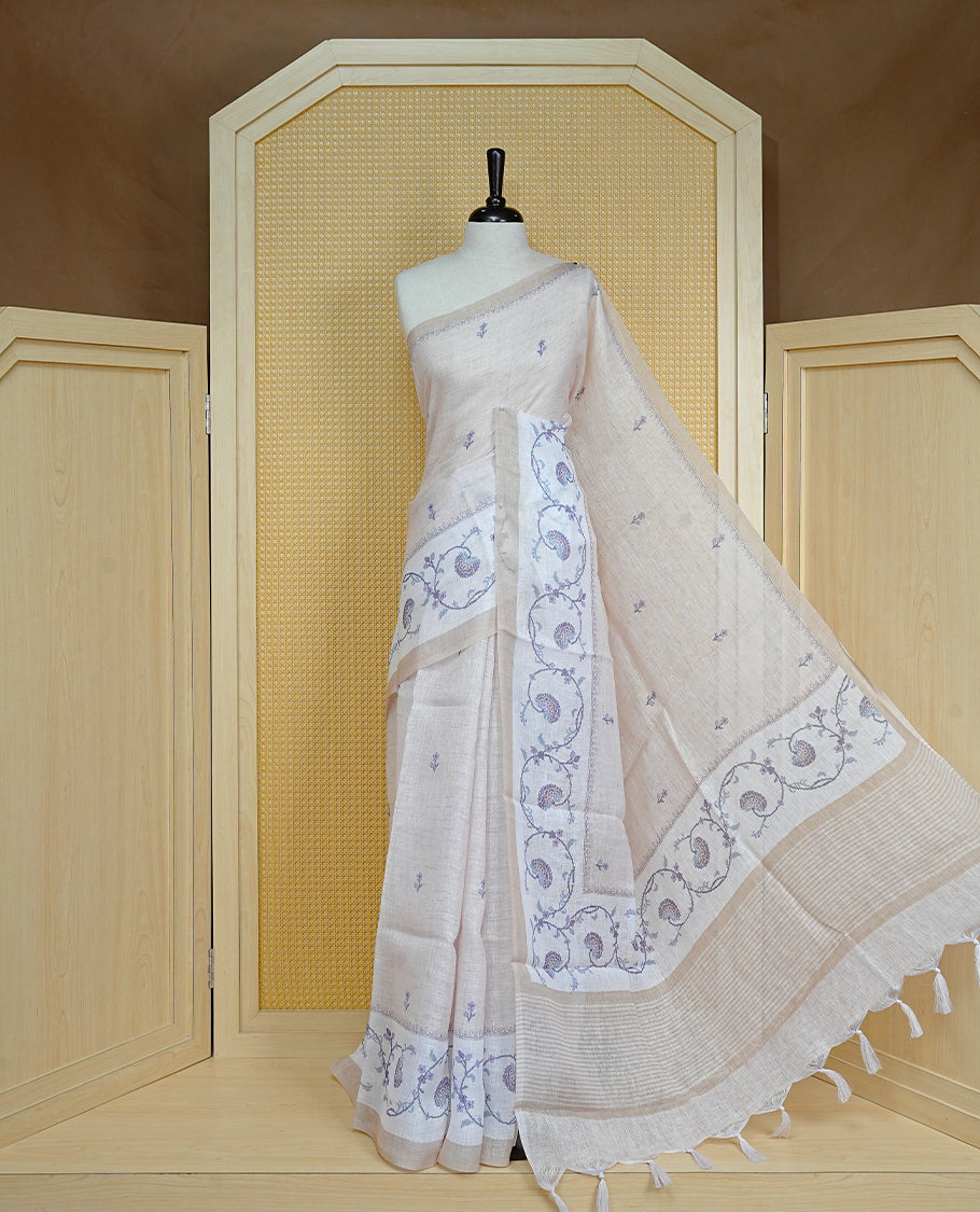 Beige colour semi linen saree featuring floral print on body, complemented by contrast Light gold colour with Design print border, comes with matching blouse piece.