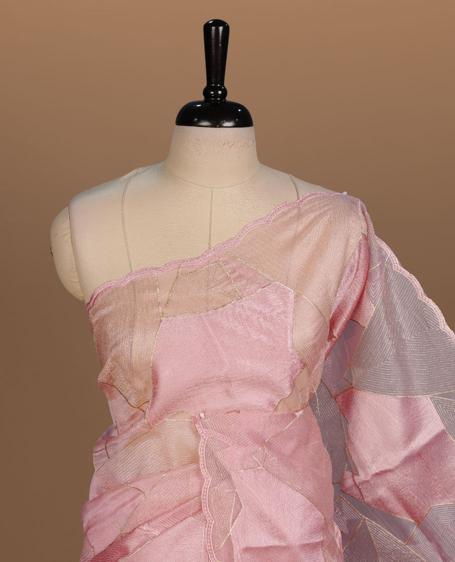 Peach colour Organza designer saree featuring a thread geometric pattern across the body, enhanced with a piping border and cut beats work on matching blouse piece.