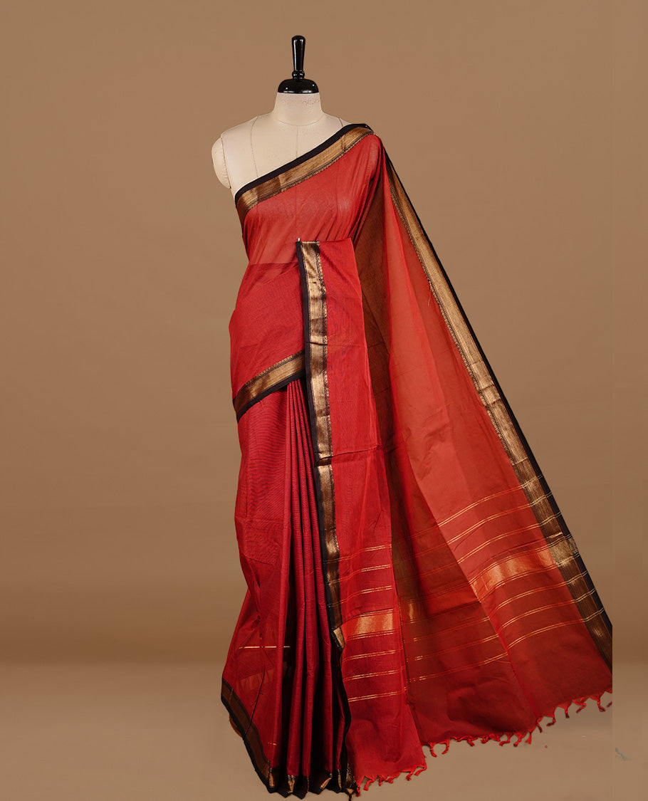 Dark red colour chettinad cotton saree featuring Plain body, complemented by Chocolate with zari border, paired with matching blouse piece.