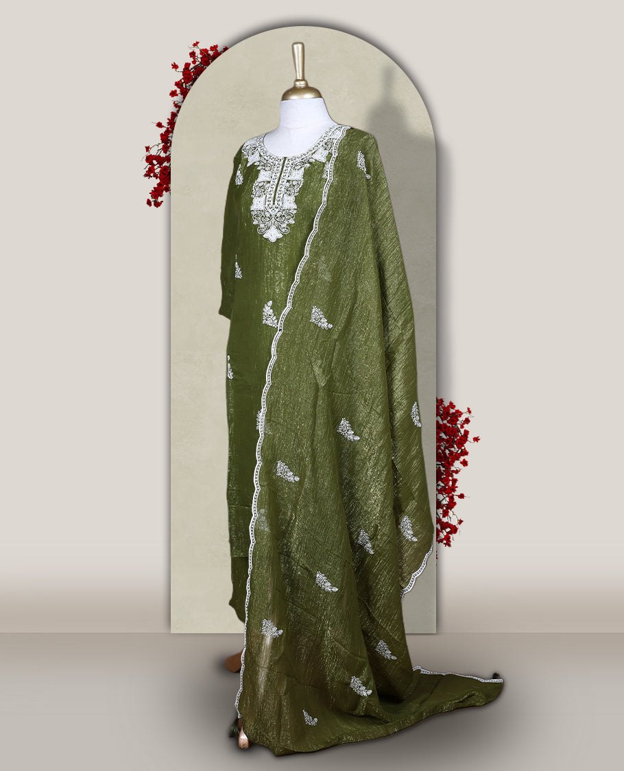 Green colour churidar set featuring elegant white thread embroidery on the neckline, sleeves, and scattered motifs across the body, Paired with a matching embroidered dupatta, this ensemble radiates graceful charm and festive appeal.