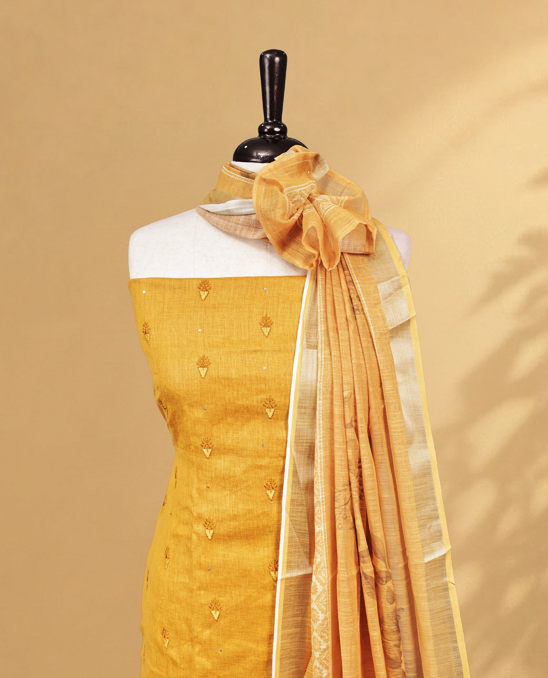Mastard Colour Salwar material Featuring Embroidery work on body, paired with Matching Bottom and same Patterned Dupatta.