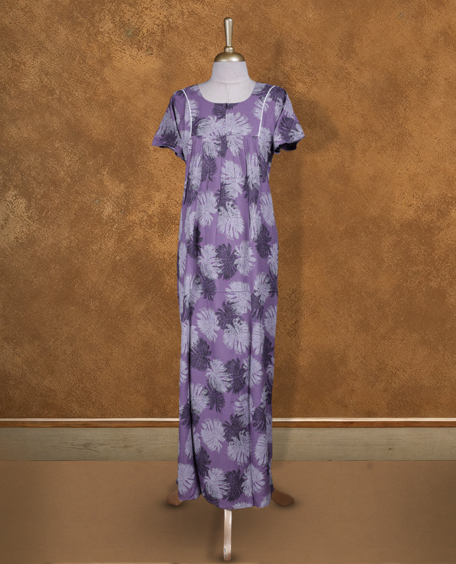 lavender colour NStyle nighty featuring Black and White Leaf patterns, a Round neckline and thread border, short sleeves, and a full ankle-length design.