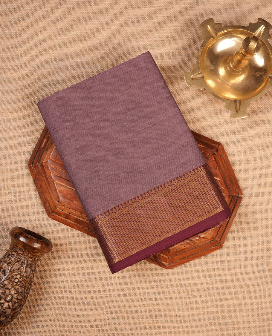 Lilac colour chettinad cotton saree featuring Elegant plain body highlighting contrast Maroon colour with gold zari traditional border, pallu and paired with matching blouse piece.