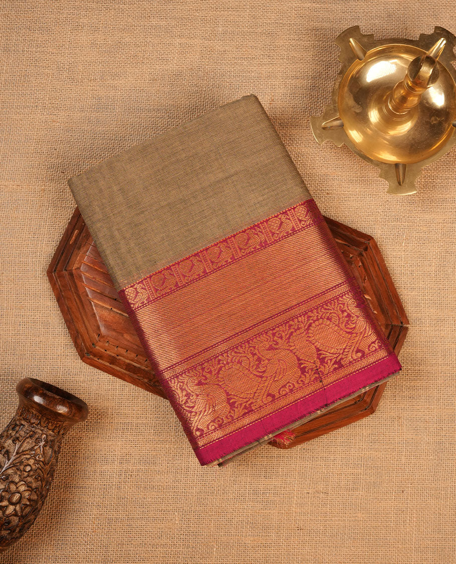 Beige colour chettinad cotton saree featuring Elegant plain body, contrast Magenta colour border with gold zari border, pallu and paired with matching blouse.