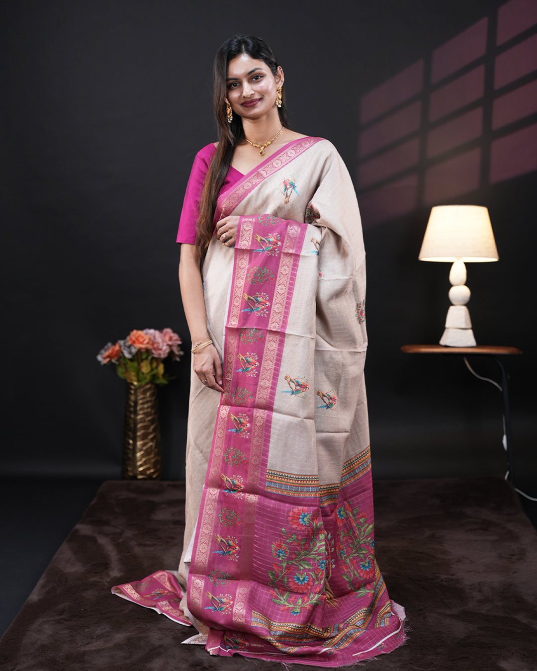 Cream Colour Moss chiffon saree featuring Double Parrot & Floral prints on the body, Pink Colour double border with peacock prints, and a contrast designed pallu, paired with a contrast designed blouse piece.