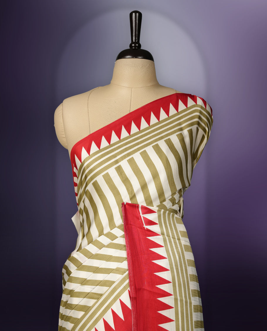 Beige colour saree with olive green stripes, highlighted by a striking red geometric border and a beautifully patterned pallu with intricate motifs, comes with a matching blouse.