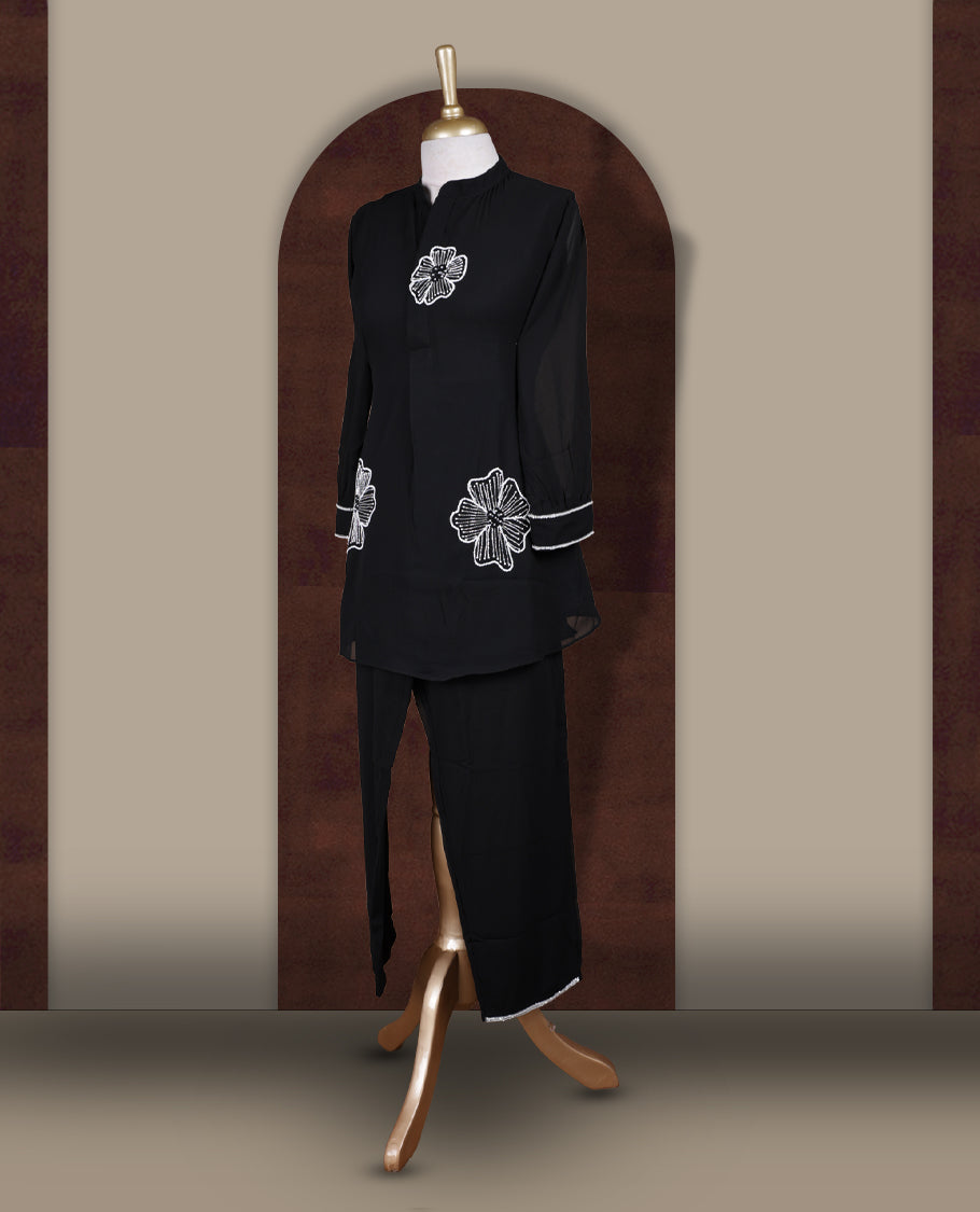 Black colour coord set featuring elegant pearls and cut beads floral embroidery work, mandarin collar, and sheer 3/4 sleeves, Paired with matching pants, it offers a sleek, modern look perfect for refined casual wear.