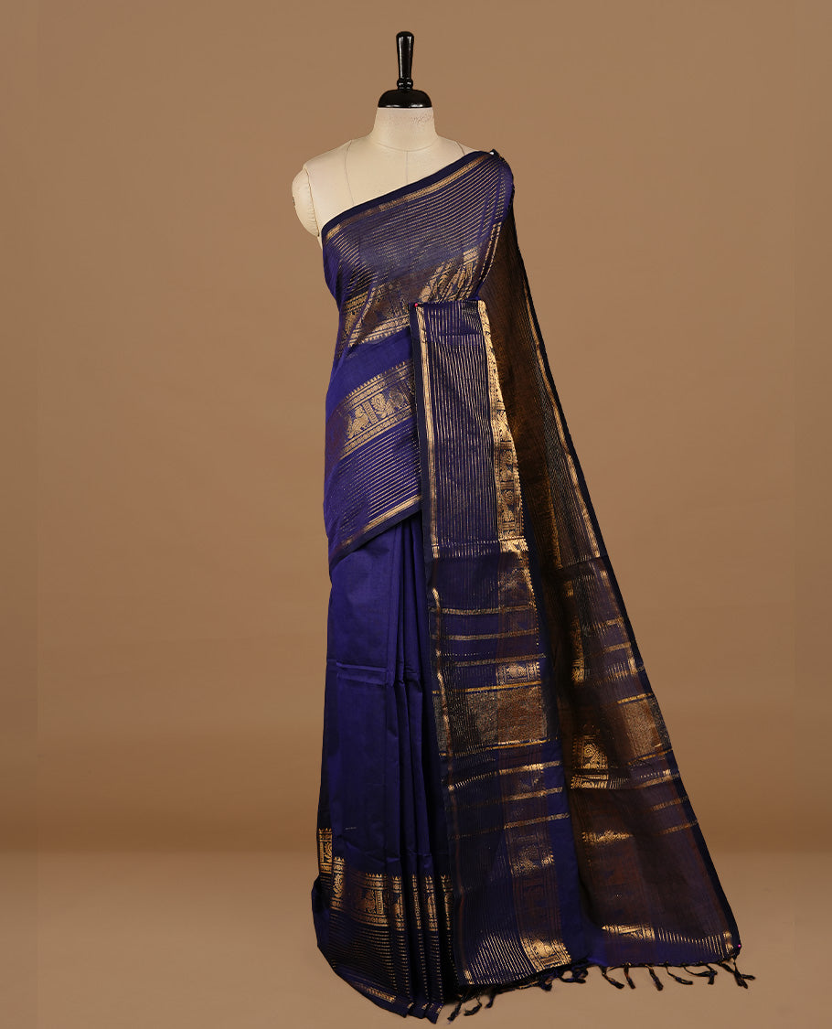 Navy blue colour chettinad cotton saree featuring Elegant plain body, complemented by self colour with zari border, paired with matching blouse piece.