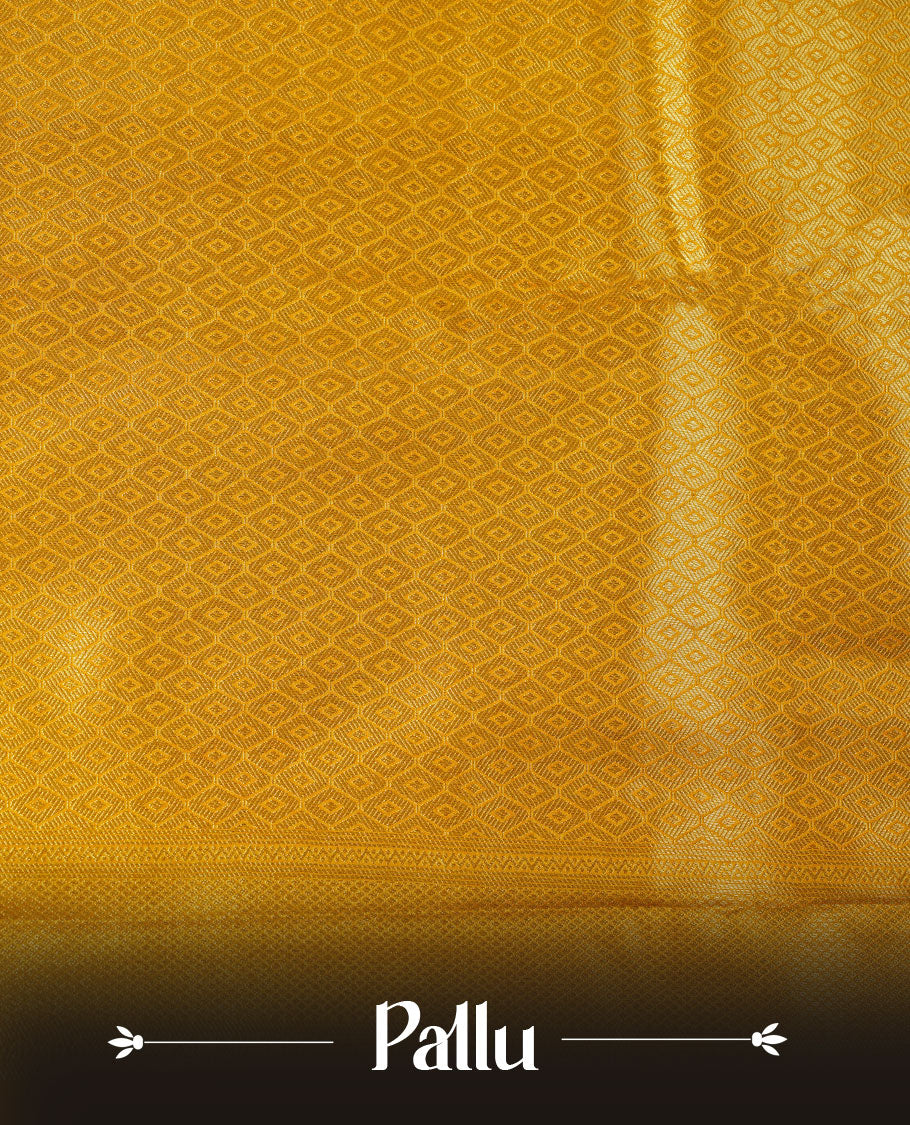 Golden mustard colour semi soft silk brocade saree featuring elegant self-woven motifs across the body, enhanced with a neatly detailed woven border and pallu, paired with a matching blouse.