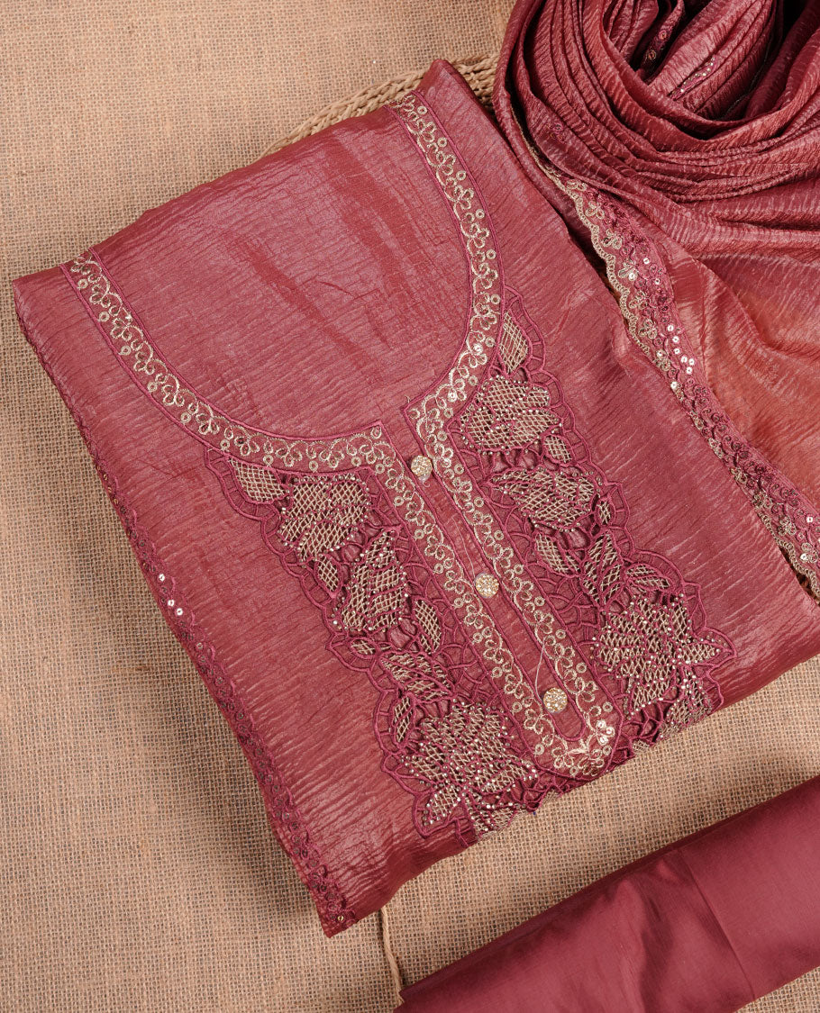 Mauve taupe colour churidar set with stone and thread embroidery and detailing, paired with matching pant and dupatta.