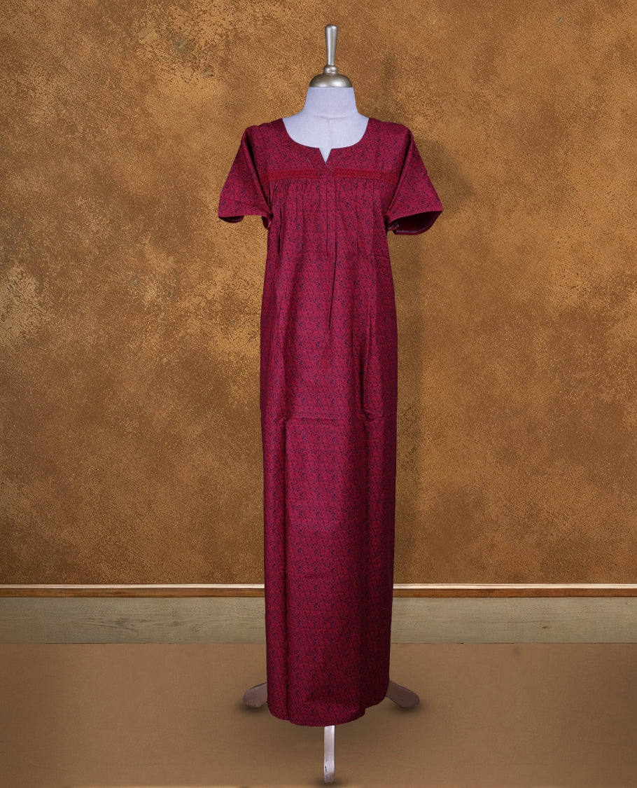 Red colour NStyle nighty features an all-over Black little floral pattern, a round neckline with a slight V-cut, short sleeves, and a full ankle-length design.