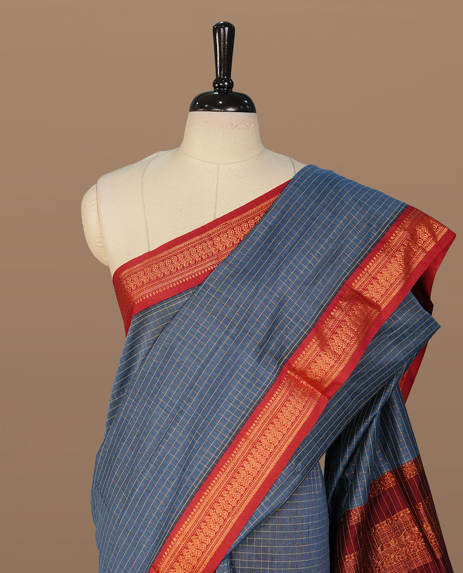 Teal colour kalyani cotton saree featuring antique zari motifs on body, complemented by Maroon colour with Antique zari border, paired with matching blouse piece. (Copy)