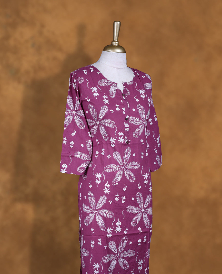 Mauve colour Kurti featuring floral print pattern across, round neckline with split, and sleeves,