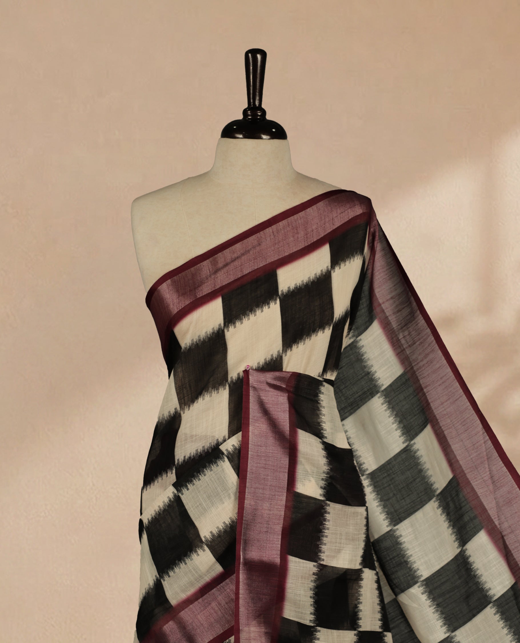 Black & White Colour Semi Linen saree featuring digital printed body, Complemented by Borderless finish, comes with matching blouse piece.