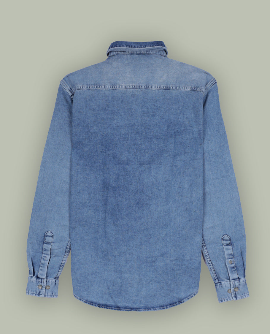 Light blue colour denim shirt with a faded wash finish, Features two front flap pockets, button down closure, and long sleeves with cuffs, Perfect for a rugged yet casual look.