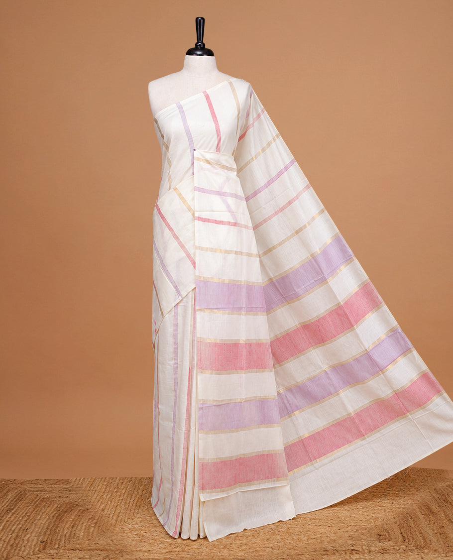 Cream Colour Cotton Kerala Saree Featuring Pastel Red & Lavender Strips On The Body & Pallu, Paired With A Matching Blouse Piece.