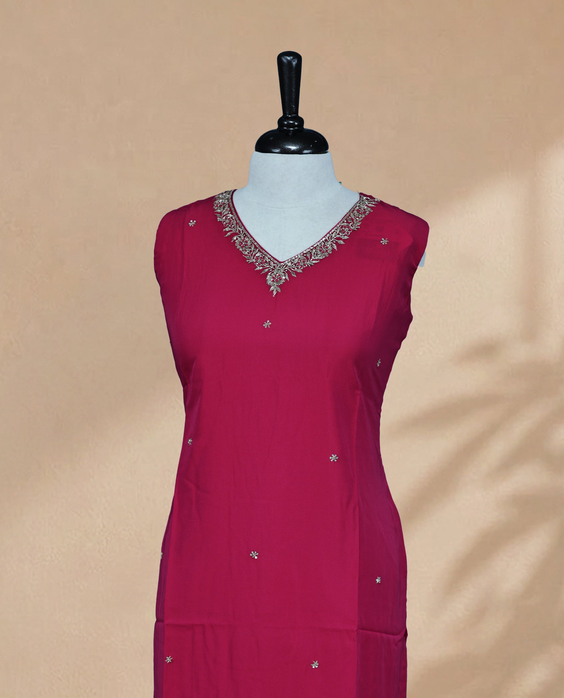Rani Pink Kurti featuring sequin and beadwork across the body, a V-shaped neckline adorned with bead and sequin work, and a sleeveless design.