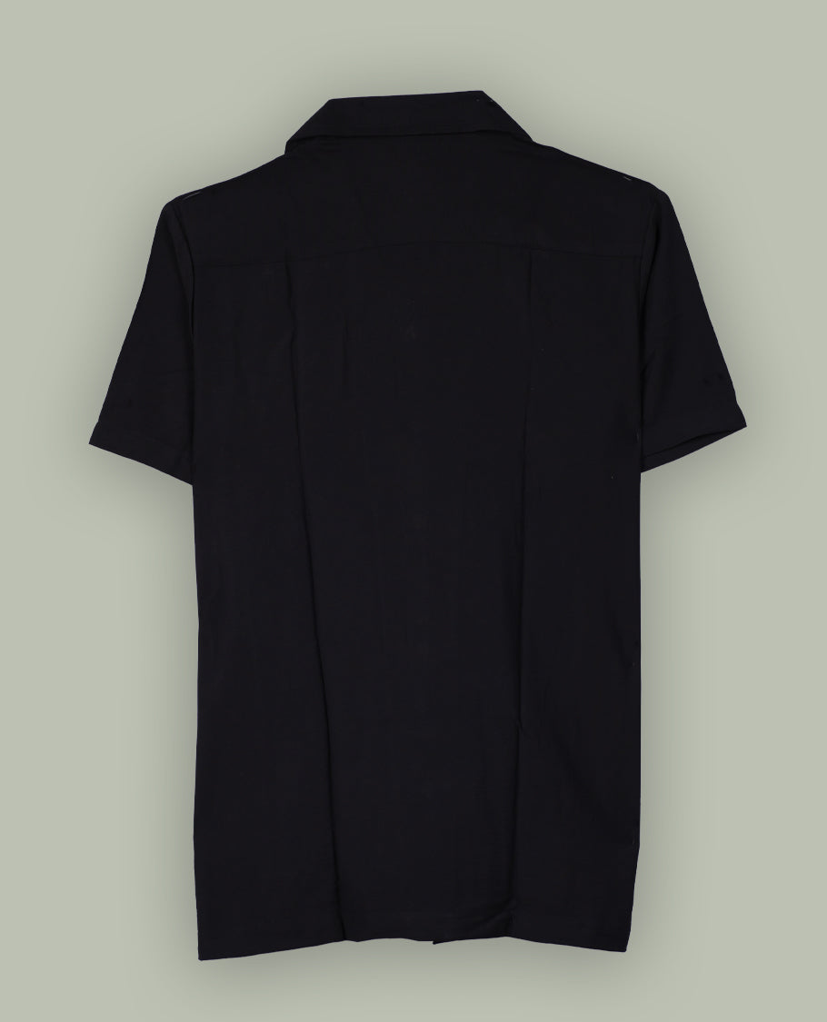 Black colour shirt featuring elegant white embroidery motifs on the body, Designed with a classic shirt collar and short sleeves, it blends contemporary style with subtle detailing.