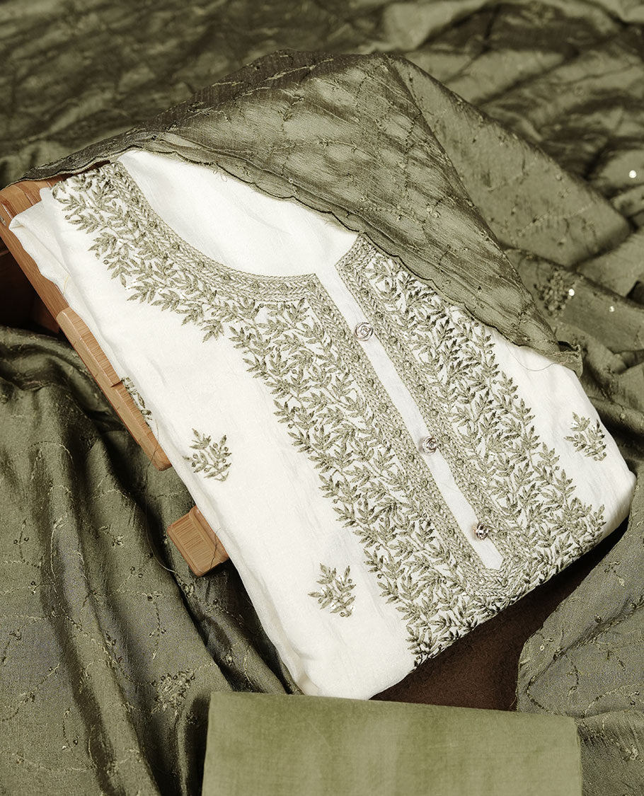 Ivory colour churidar material with sage green colour thread embroidery on the front panel, paired with a matching dupatta and bottom.