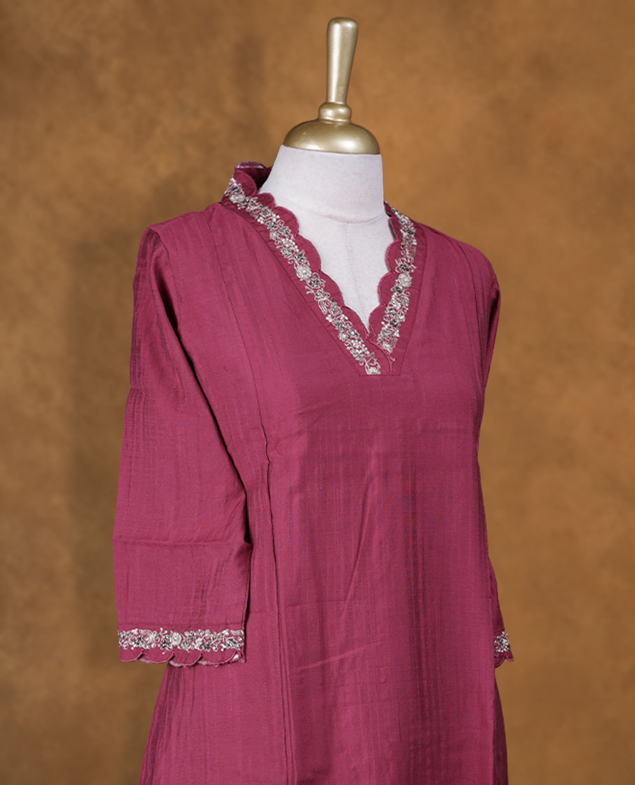 Burgundy colour coord set with styled with a collar V with sweetheart and thread & beats on neckline & sleeve,floral , knee length design, with matching bottom .