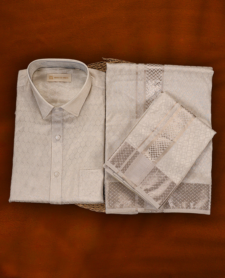 White silver colour MINISTER WHITE jacquard shirt with an all over textured weave, paired with a matching silver zari bordered dhoti featuring intricate geometric patterns, perfect for a refined traditional look.