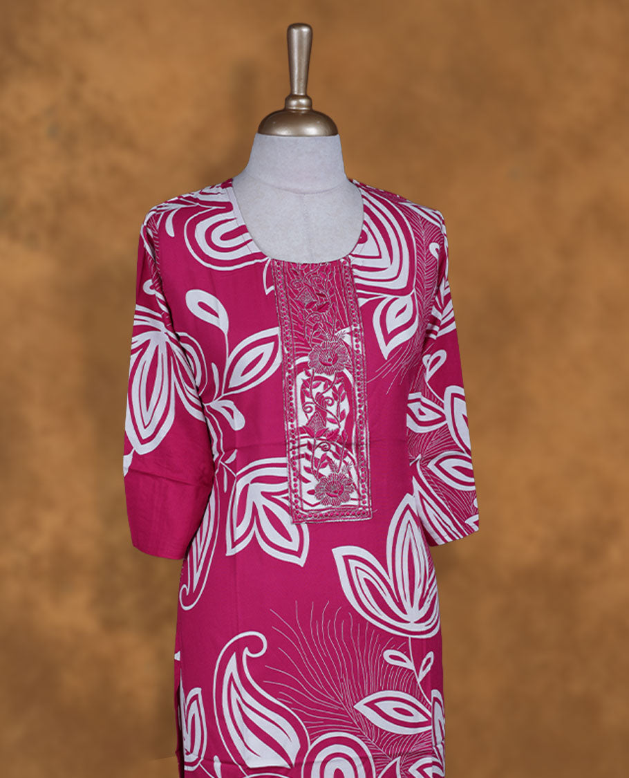 Pink colour kurti with white floral prints, knee length design, styled with a round neckline and a sleeve .