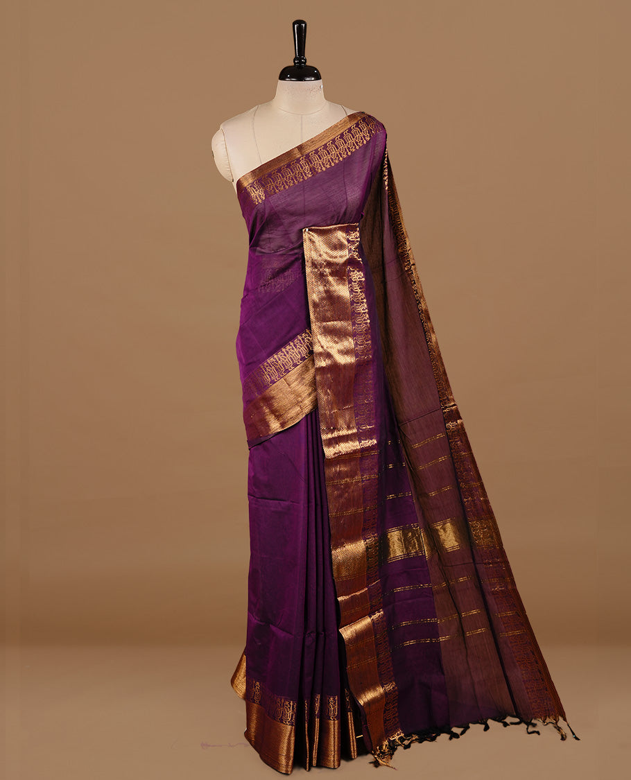 Deep purple colour chettinad cotton saree featuring elegant plain body, complemented by self colour with zari border, paired with matching blouse piece.