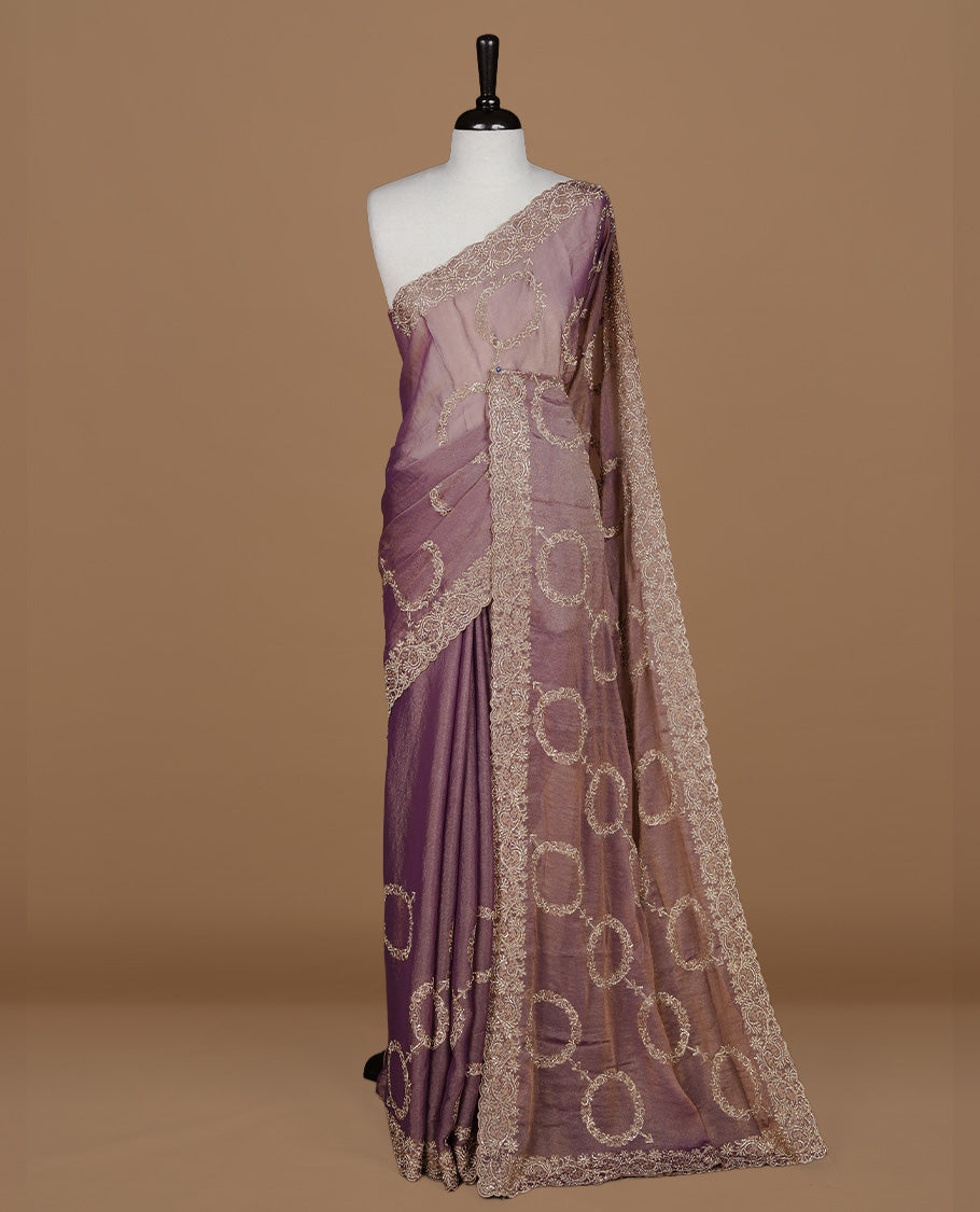 Purple colour organza saree featuring thread & gold stone pattern on body, highlighting scalp border, paired with Matching blouse piece.