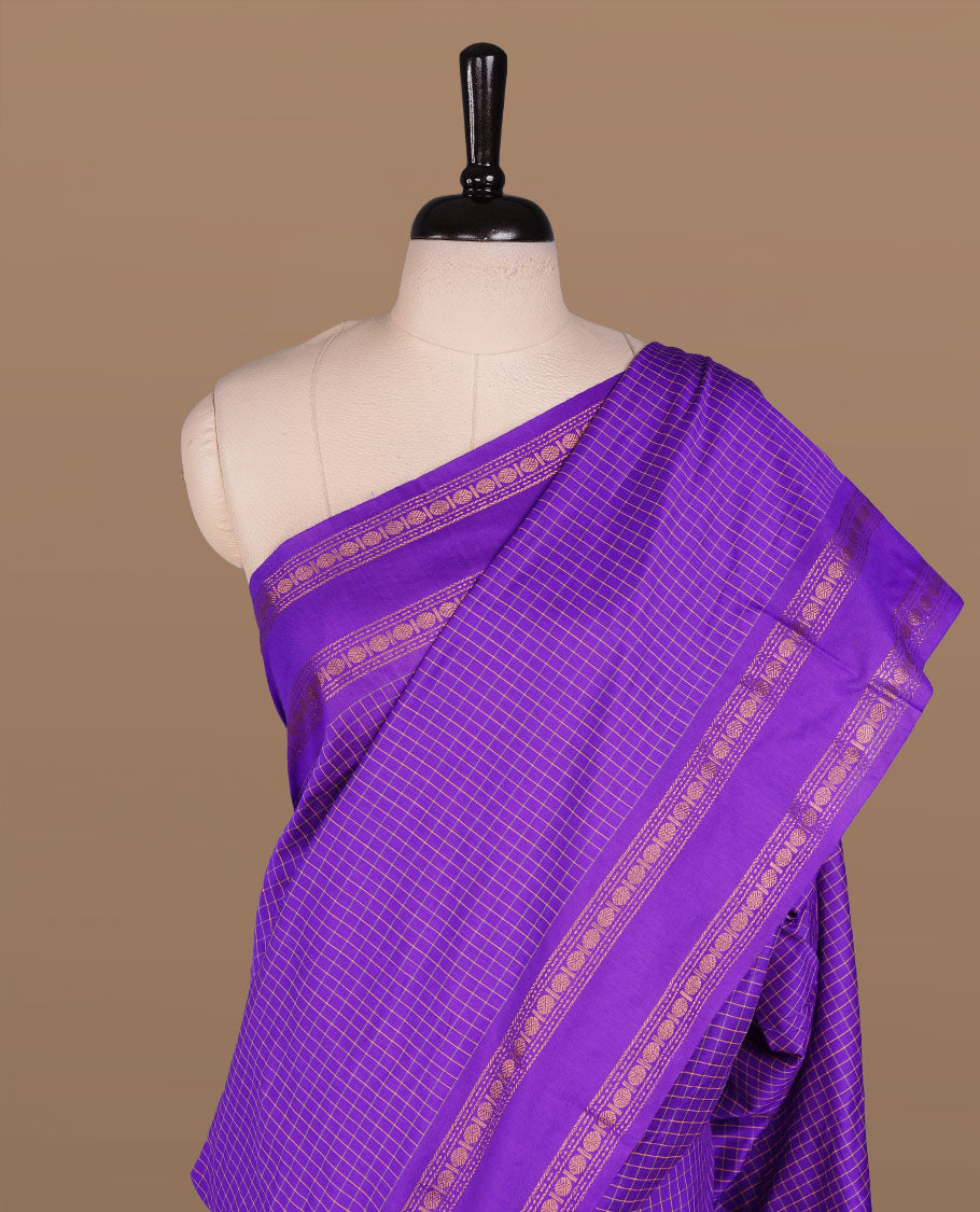 Indigo colour kalyani cotton saree featuring check pattern on body, complemented by self colour with traditional border, paired with matching blouse piece.