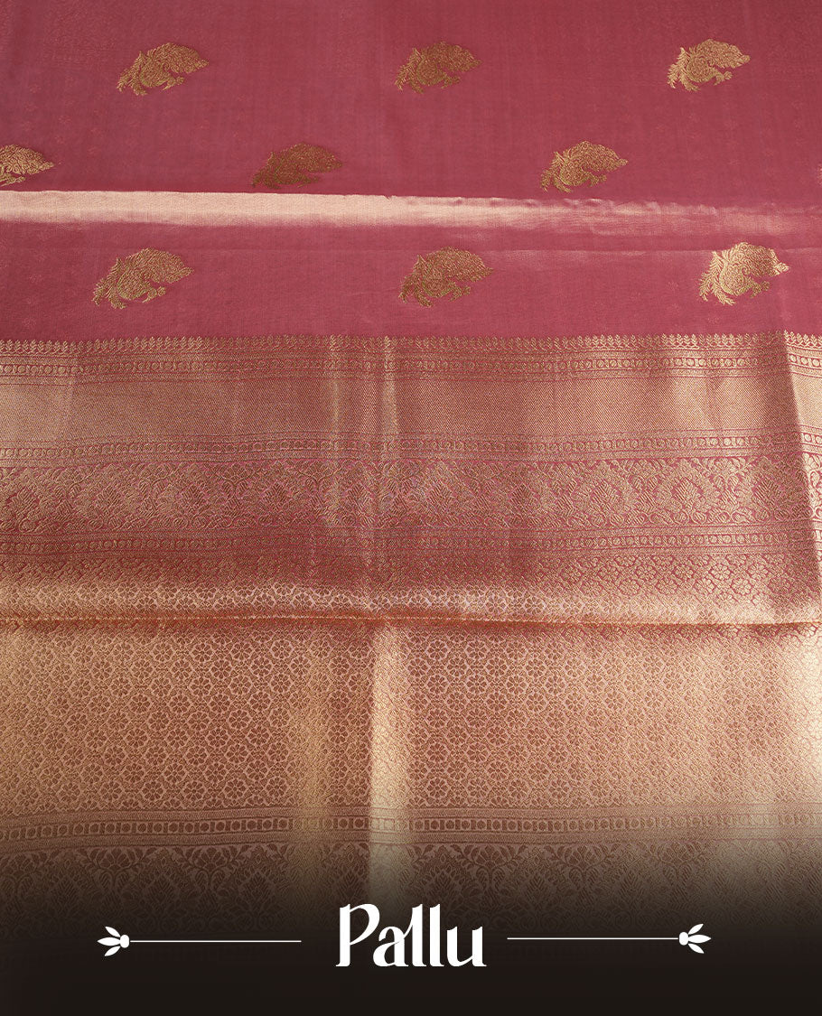 Dual tone peach and dark pink colour tissue brocade saree featuring antique gold zari motifs on the body with a rich traditional zari border and pallu, paired with a matching blouse piece.