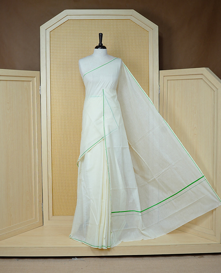 Cream Colour Cotton Kerala Saree Featuring A Classy Plain Body For Effortless Elegance, Enhanced By A Minimalist Light Green Border, Paired With A Matching Blouse Piece