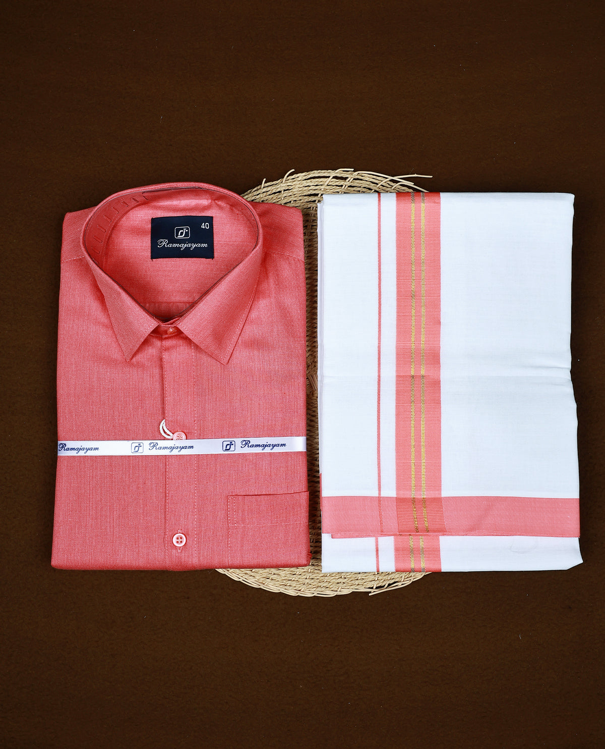 Coral pink colour RAMAJAYAM shirt paired with a matching dhoti, finishing with Coral pink & Gold kara