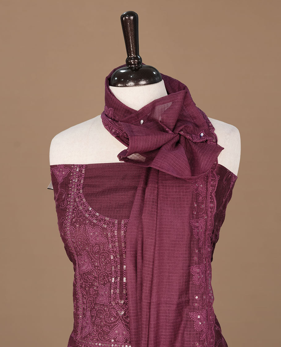 Burgundy colour churidhar material featuring self colour thread and sequins work on body, paired with matching bottom and Dupatta.