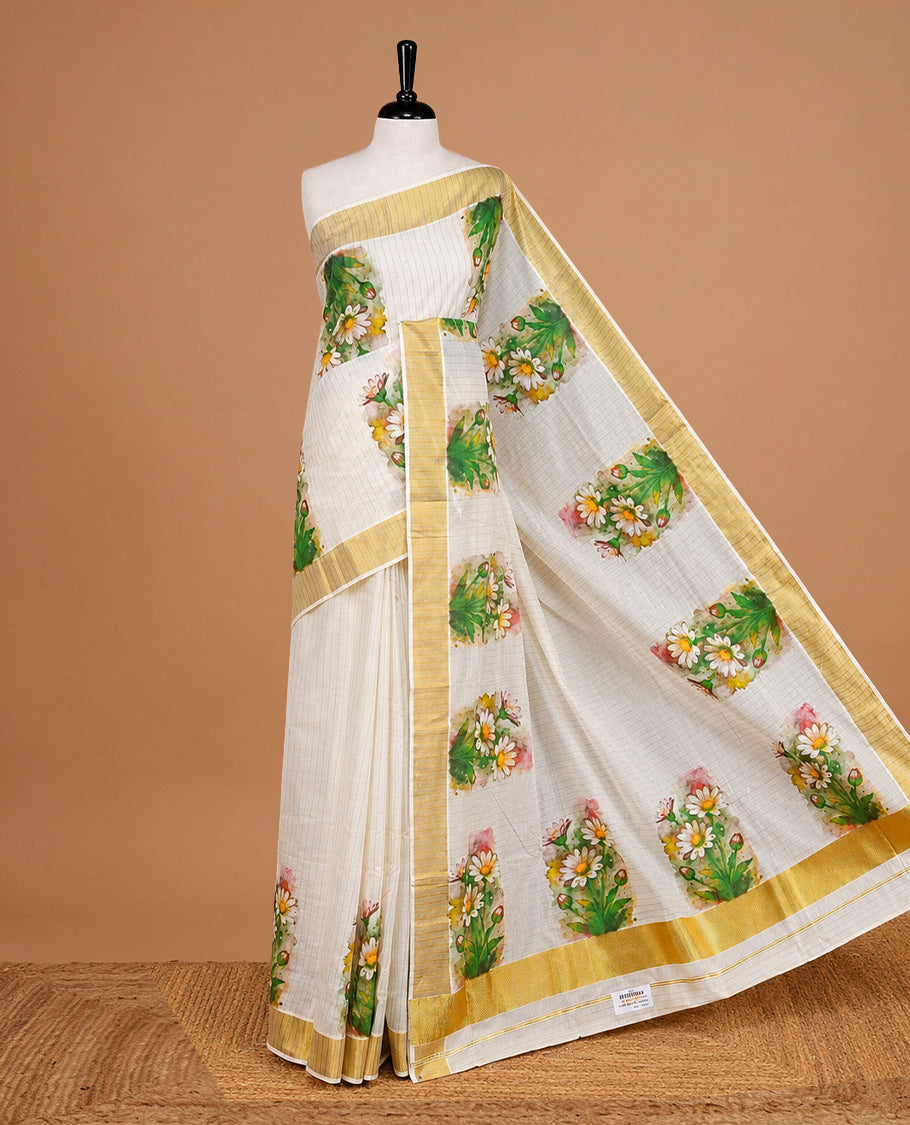 Cream Colour Kerala Saree Featuring Gold Stripes On The Body, Complemented By A Traditional Gold Zari And Floral Printed Border, Paired With A Matching Blouse Piece.