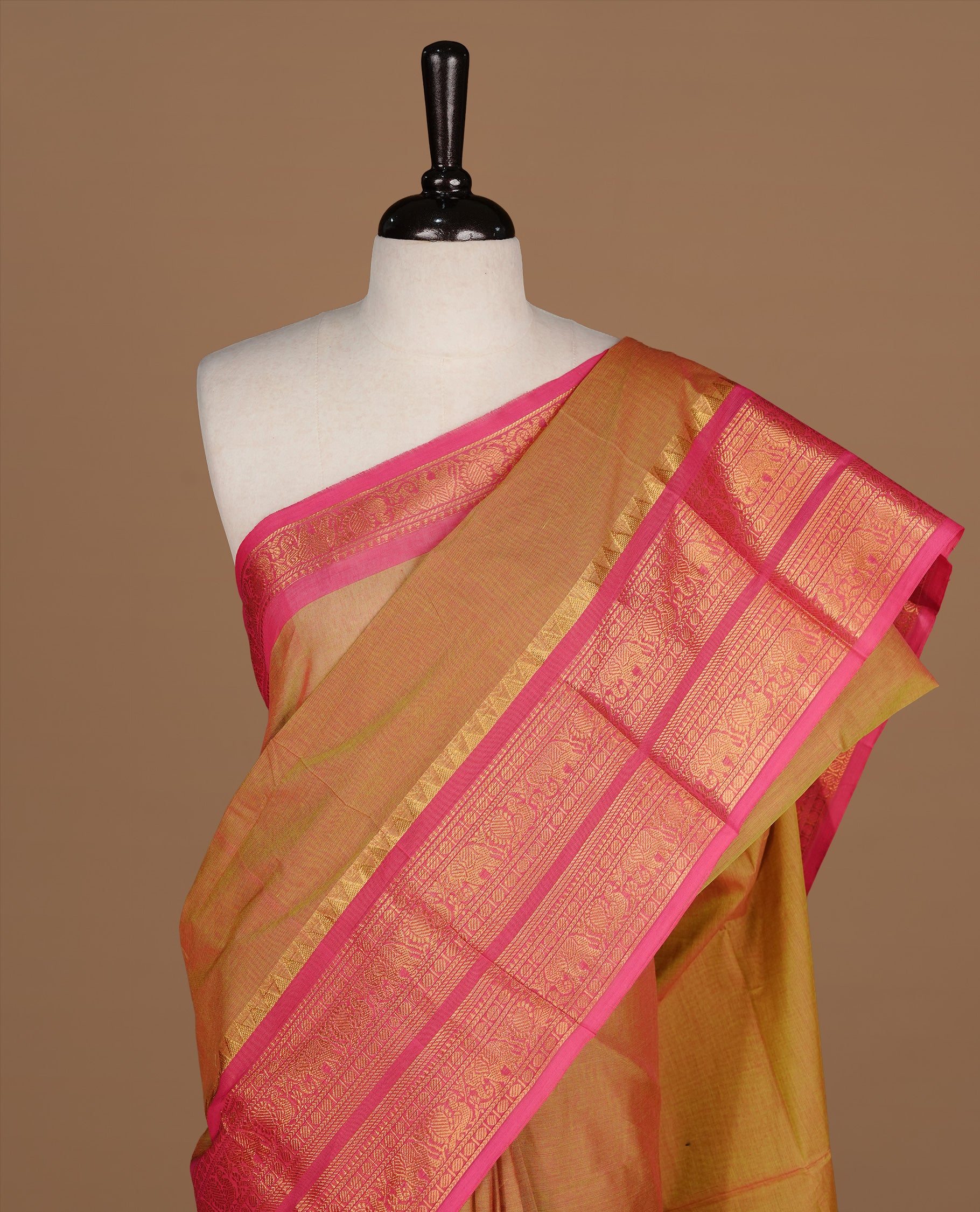 Olive colour Chettinad cotton saree featuring Elegant plain body, complemented by contrast Maroon colour with gold zari border, paired with matching blouse piece.