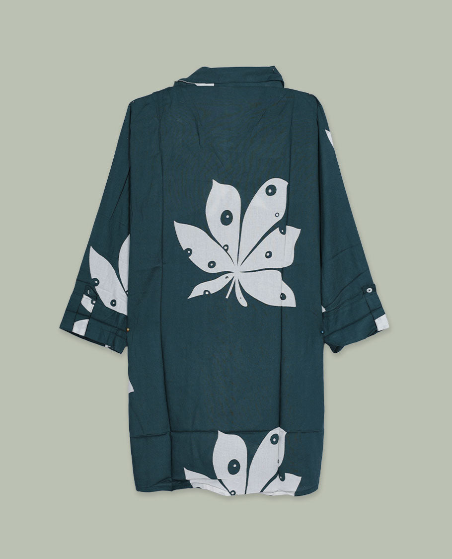 Dark green printed shirt top featuring a spread collar, button-down front, and three-quarter sleeves with cuff detail, finished in a relaxed longline fit.