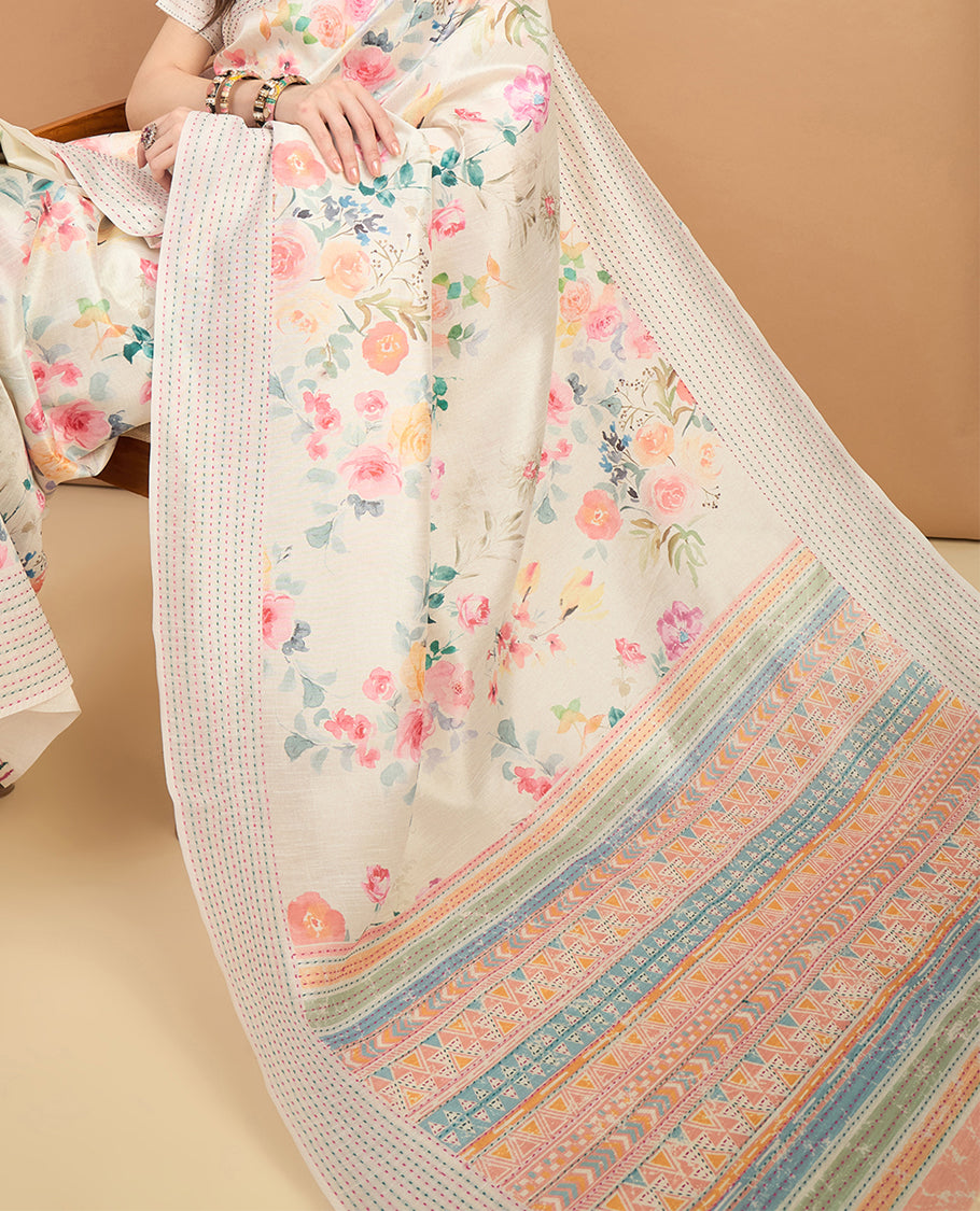 Cream toned semi tussar saree featuring delicate multicolour floral prints on the body, accented with a pastel hued Katha style stitched border and blue & yellow printed pallu Comes with a matching floral printed blouse for a graceful look.