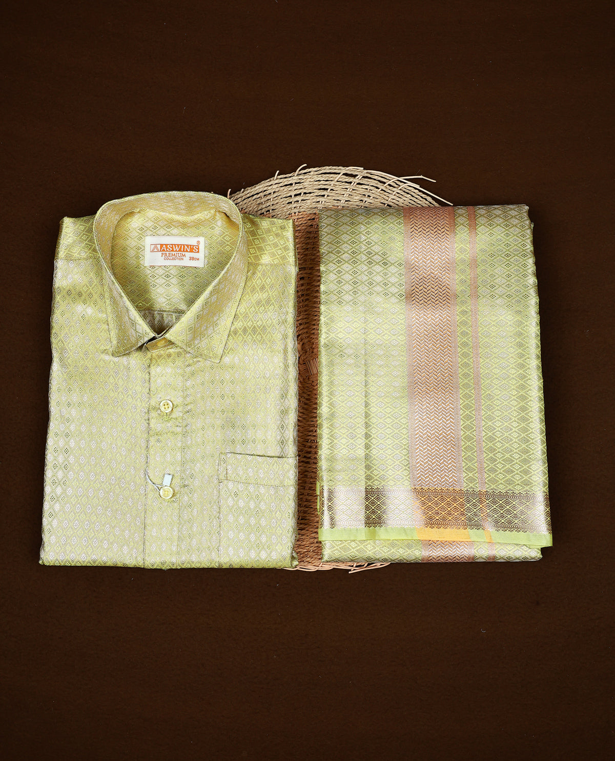Pista green colour ASWIN'S shirt paired with a matching dhoti, finishing with a Gold border