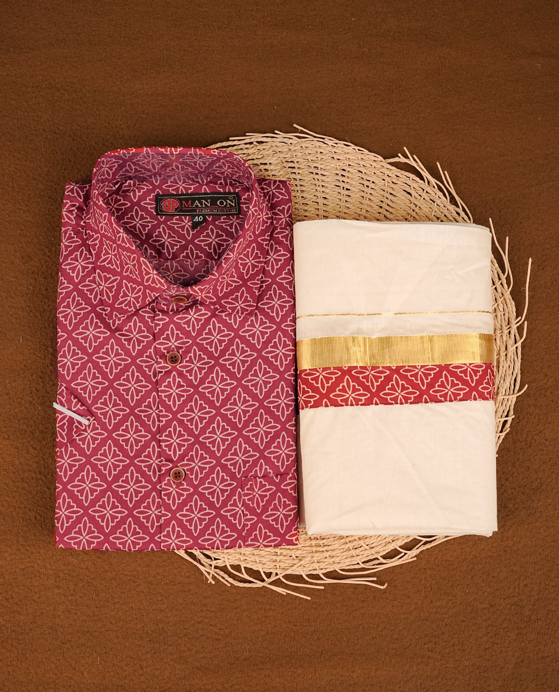 Maroon colour shirt featuring Cream colour Pattern printed body, paired with cream colour double dhoti featuring Gold kara with Same printed border.