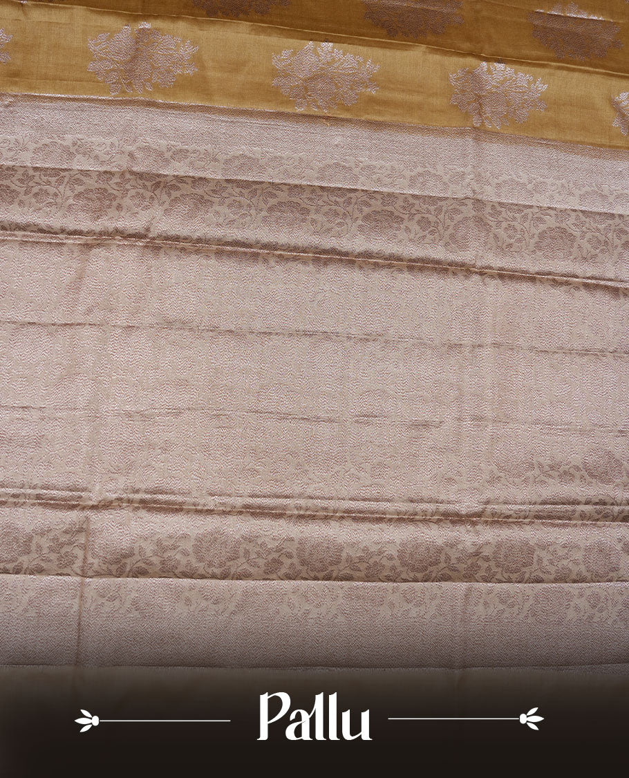 Olive colour pure banaras tusser silk saree highlighting antique zari pattern across body, with contrast cream colour with zari border and paired with matching blouse